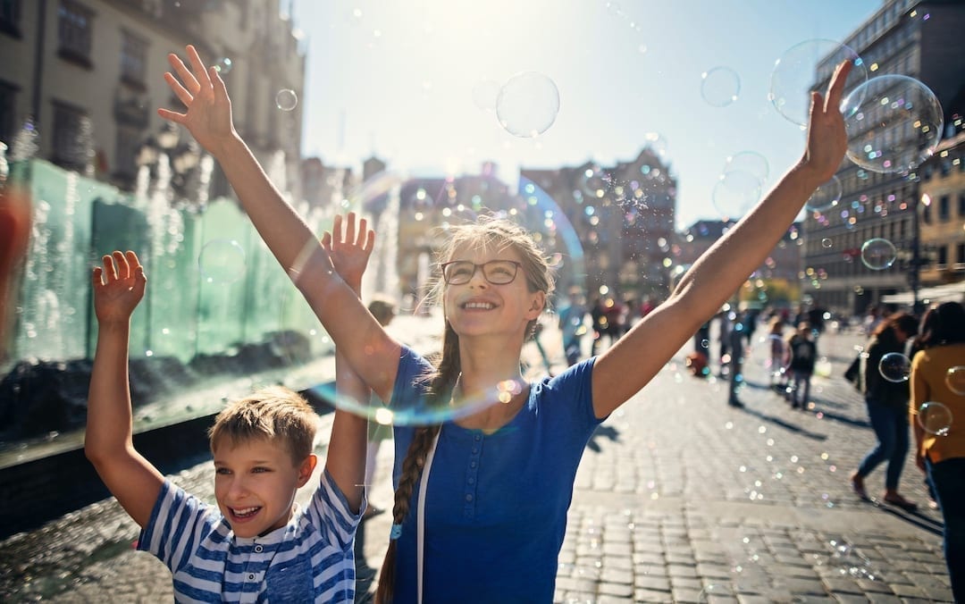 kids with bubbles in Polish town square