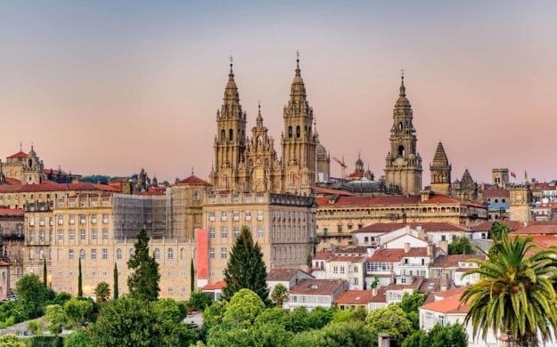 Hazy sunset on Santiago de Compostela cathedral and city view.