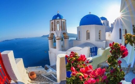 Oia village in Santorini island with famous churches, Greece