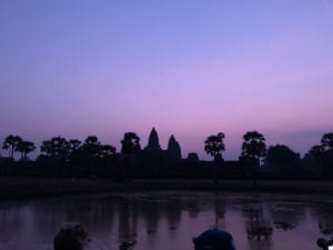 Angkor Wat silhouette against purple sky