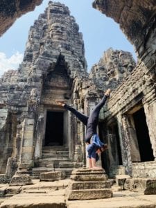 woman doing handstand in temple