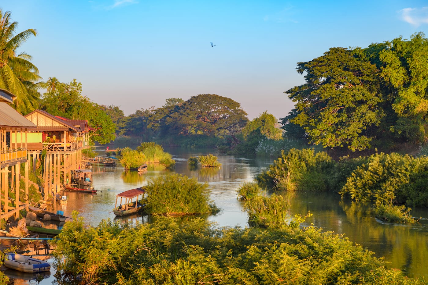 boats and stilt houses on river