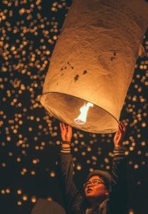 releasing lantern into the sky