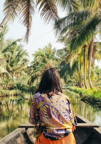 woman boating on tropical river