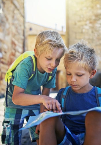 Two boys looking at map