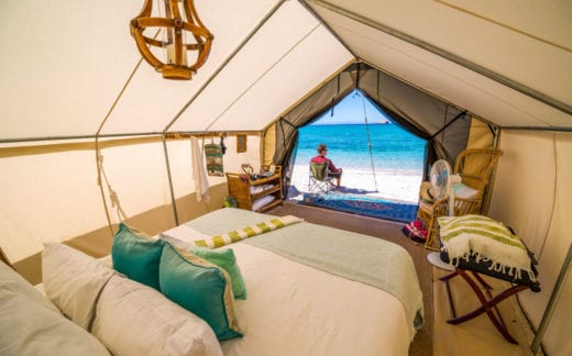 Looking out a luxury tent onto the beach
