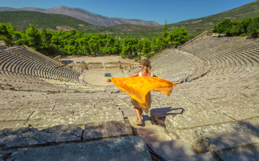 Woman walking down stairs in Epidaurus amphitheater