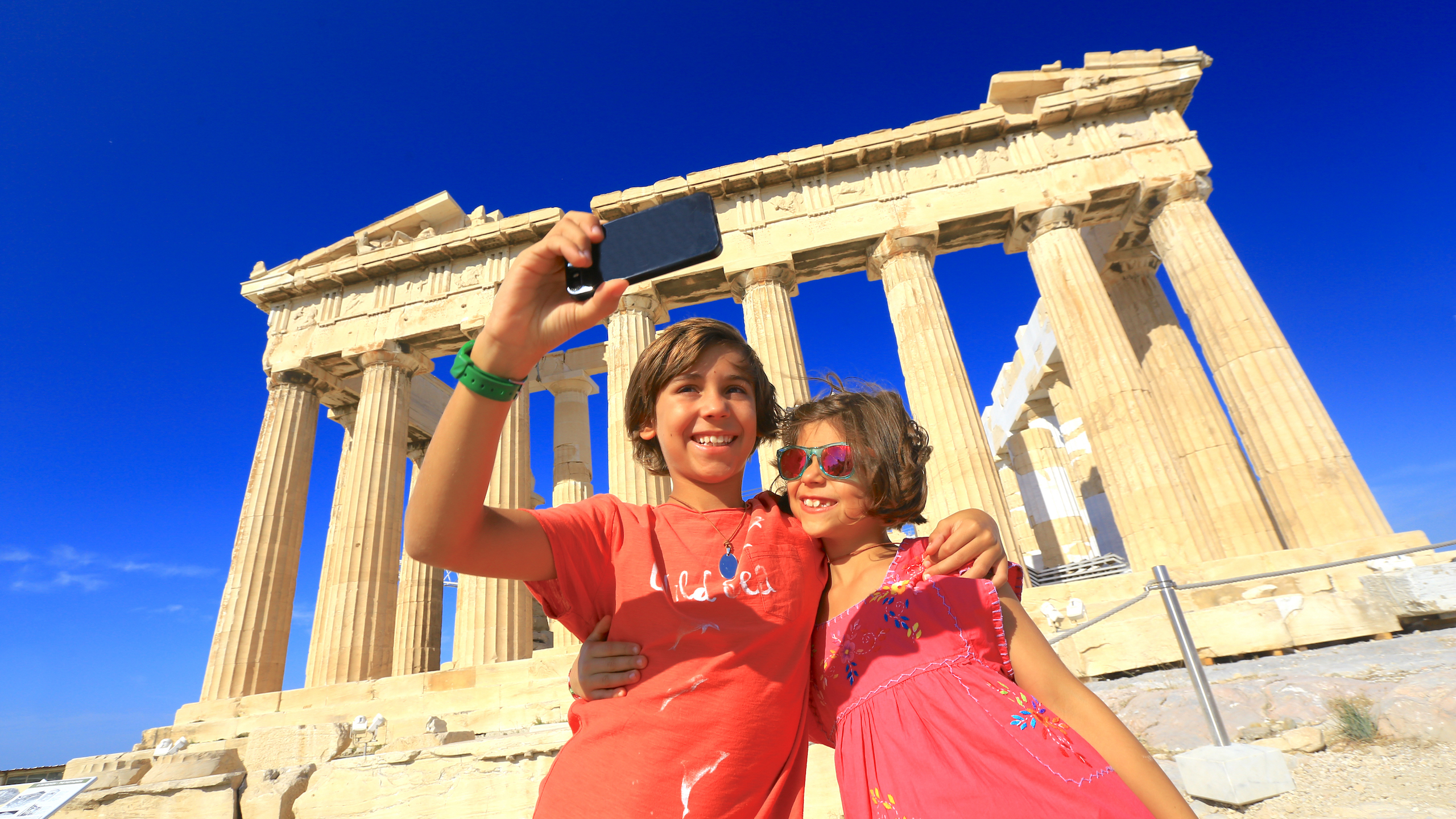 Kids taking selfie in front of Parthenon