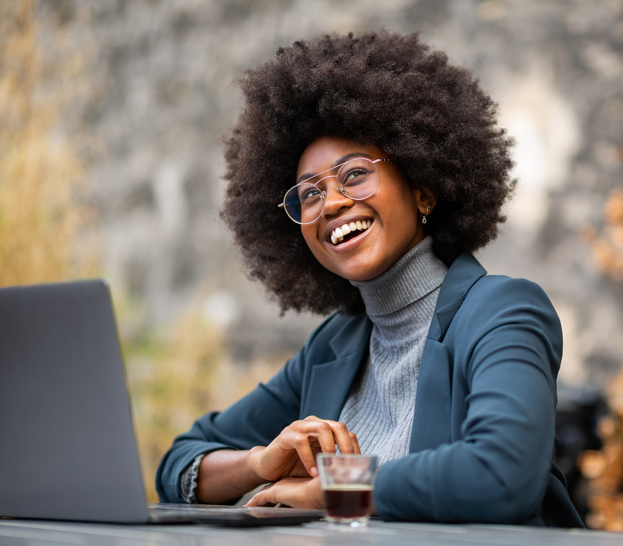 woman outdoors with laptop