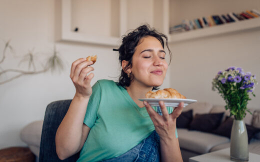 woman savoring baked good