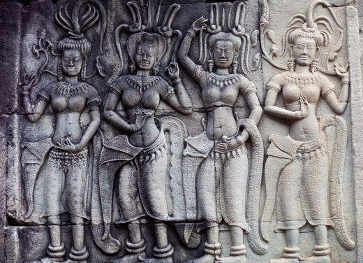Apsara Dance - ancient bas-relief at the facade of Angkor Wat in Cambodia. Angkor Wat, was built between 1113 and 1150 by King Suryavarman II.