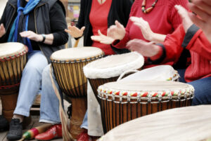 group of people, drumming, hands with motion blur