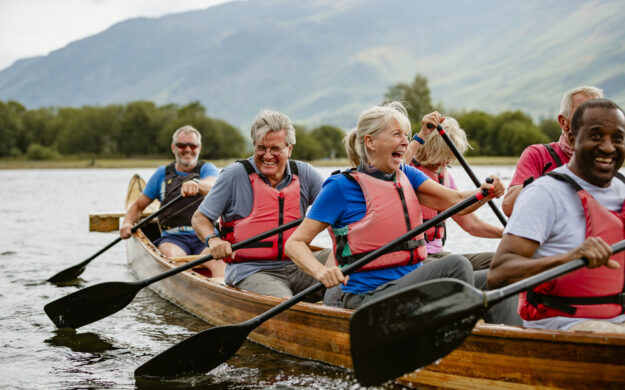 Several people paddling a canoe.