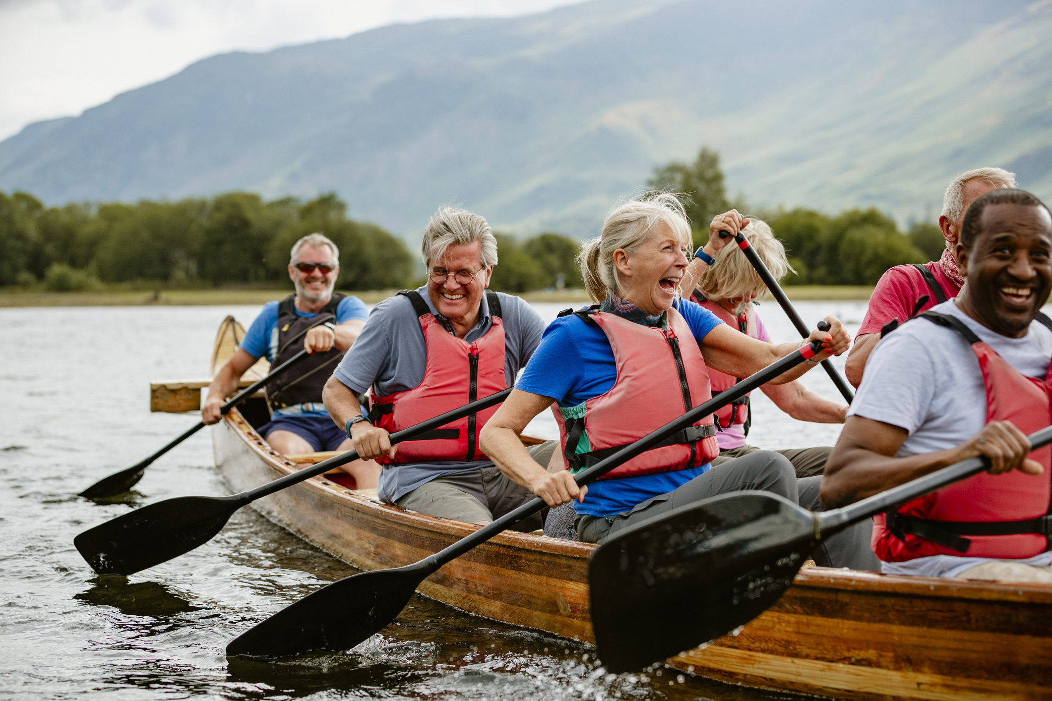 Several people paddling a canoe.