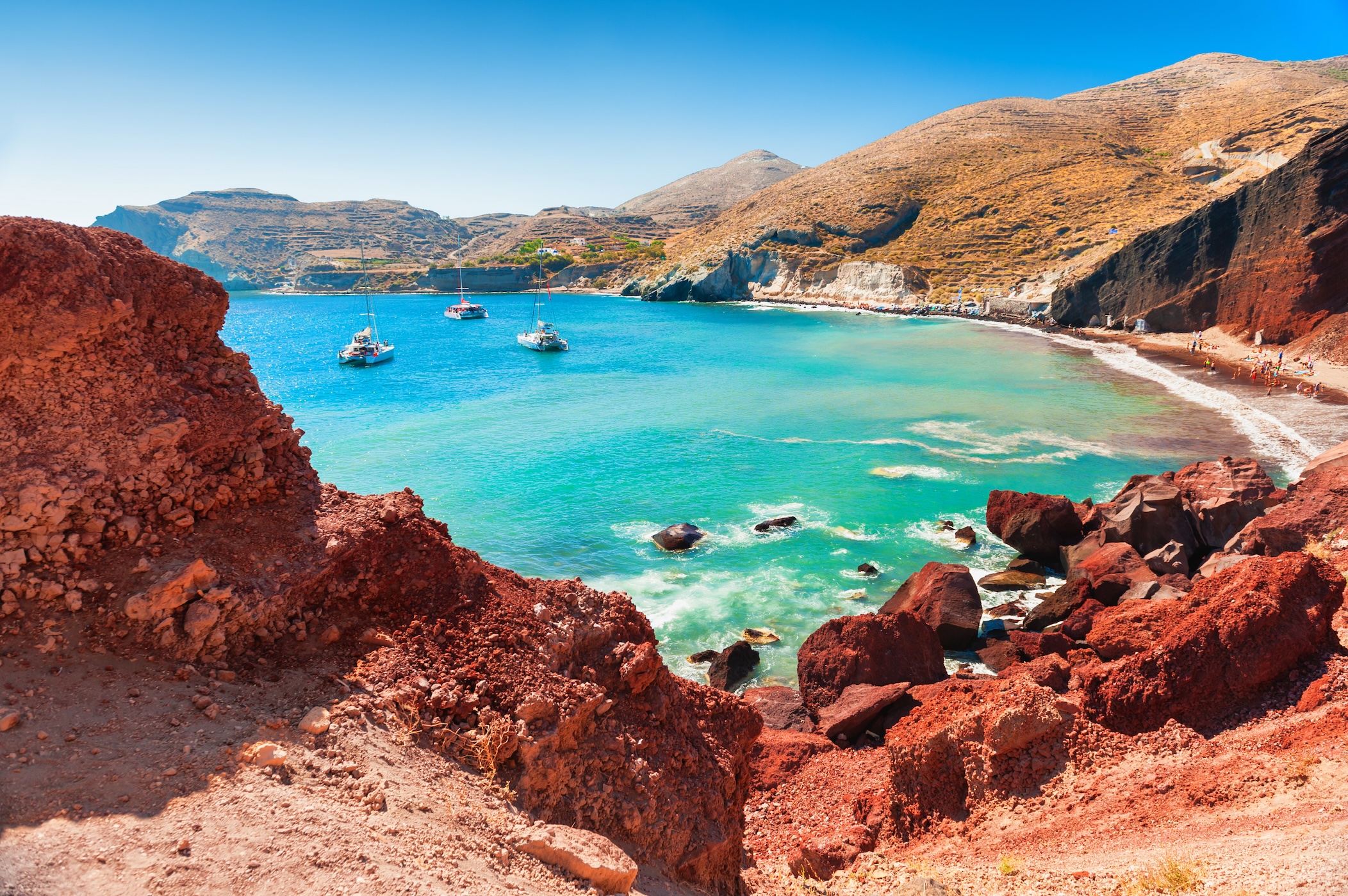 cove with turquoise water and red cliffs
