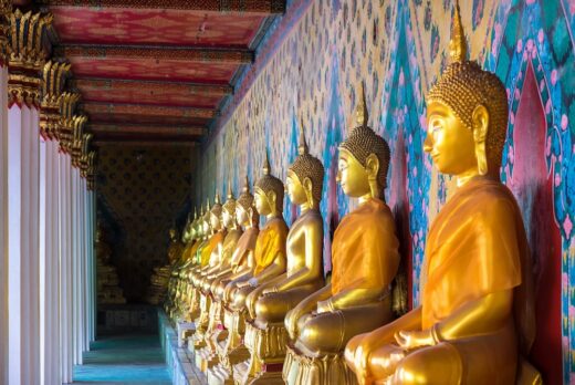 Line of golden Buddha statues