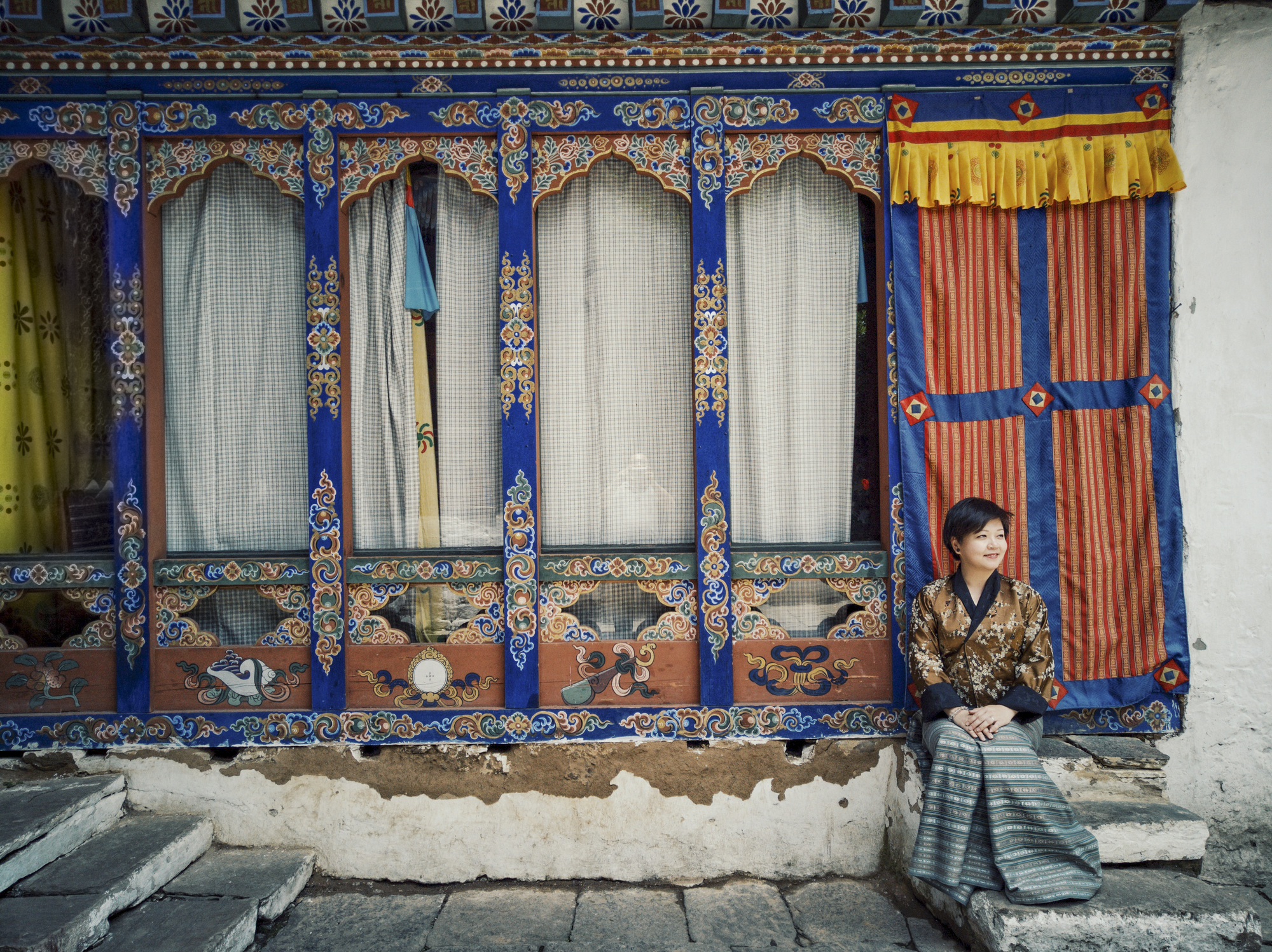 a tourist sitting in bhutan temple
