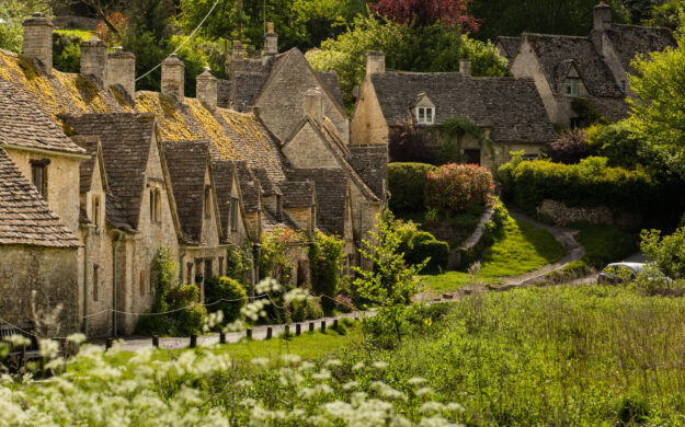 Bibury Arlington Row in The Cotswolds England. A traditional village built in Cotswold Stone.
